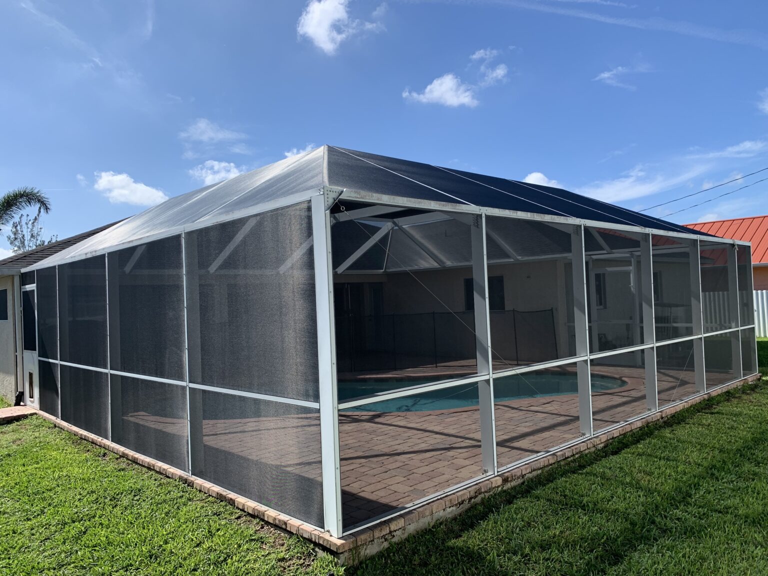 outdoor aluminum-framed swimming pool screen enclosure